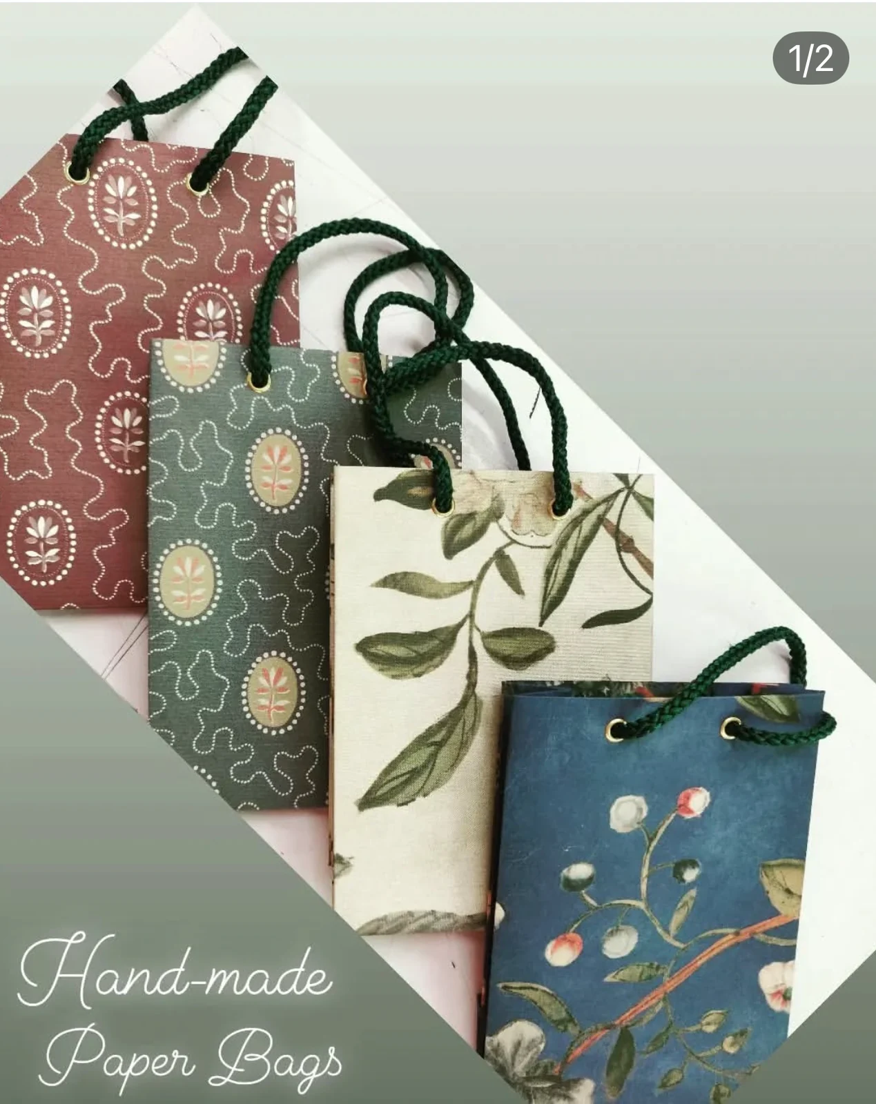 Four patterned paper gift bags with cord handles